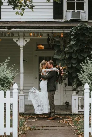 A couple on the porch of Book Village Inn