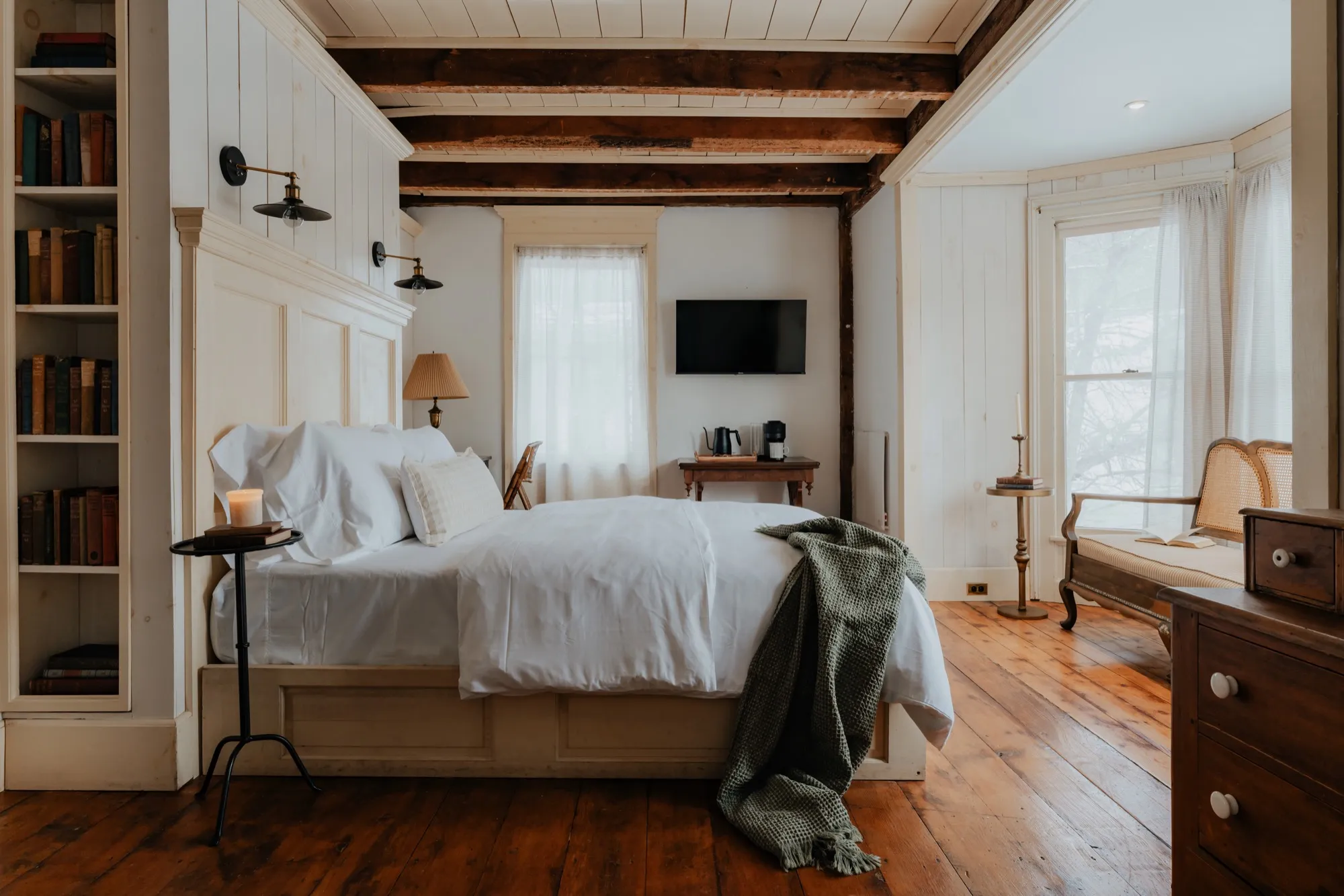 A light-filled guest room at Book Village Inn