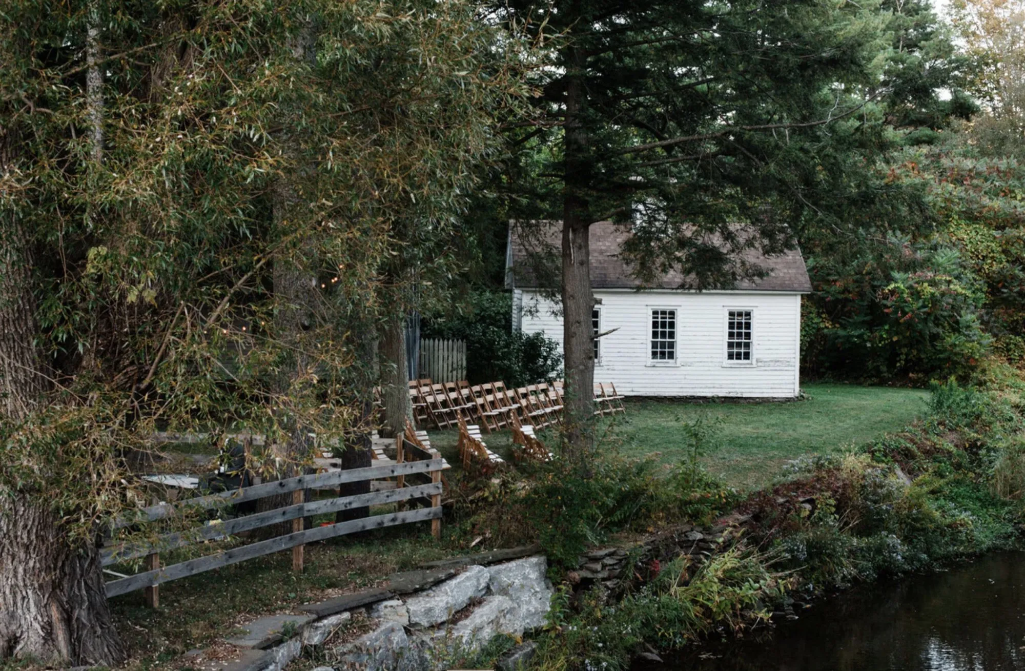 Ceremony chairs set on the lawn beside the West Branch Delaware River