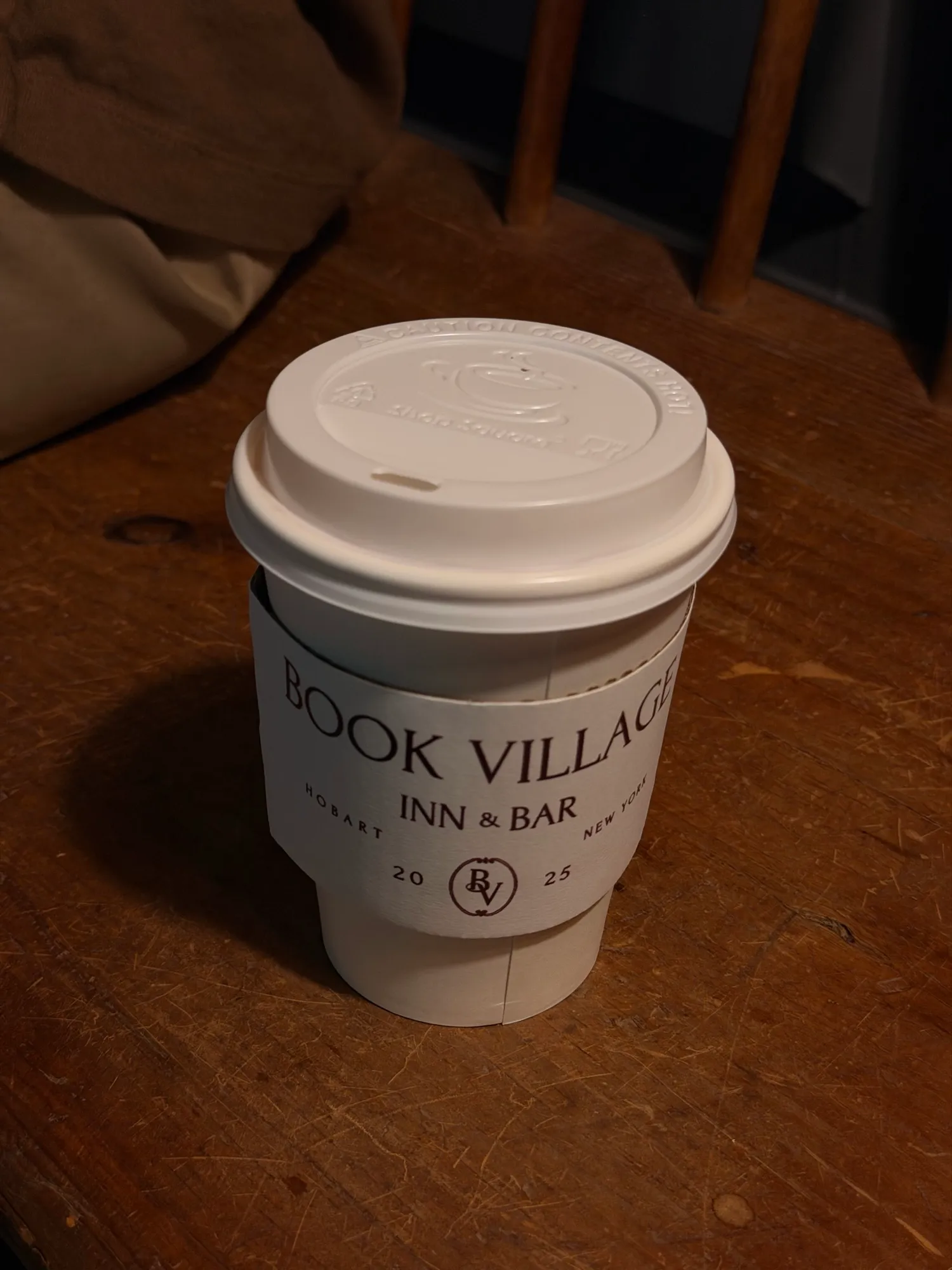 A Book Village Inn & Bar coffee cup