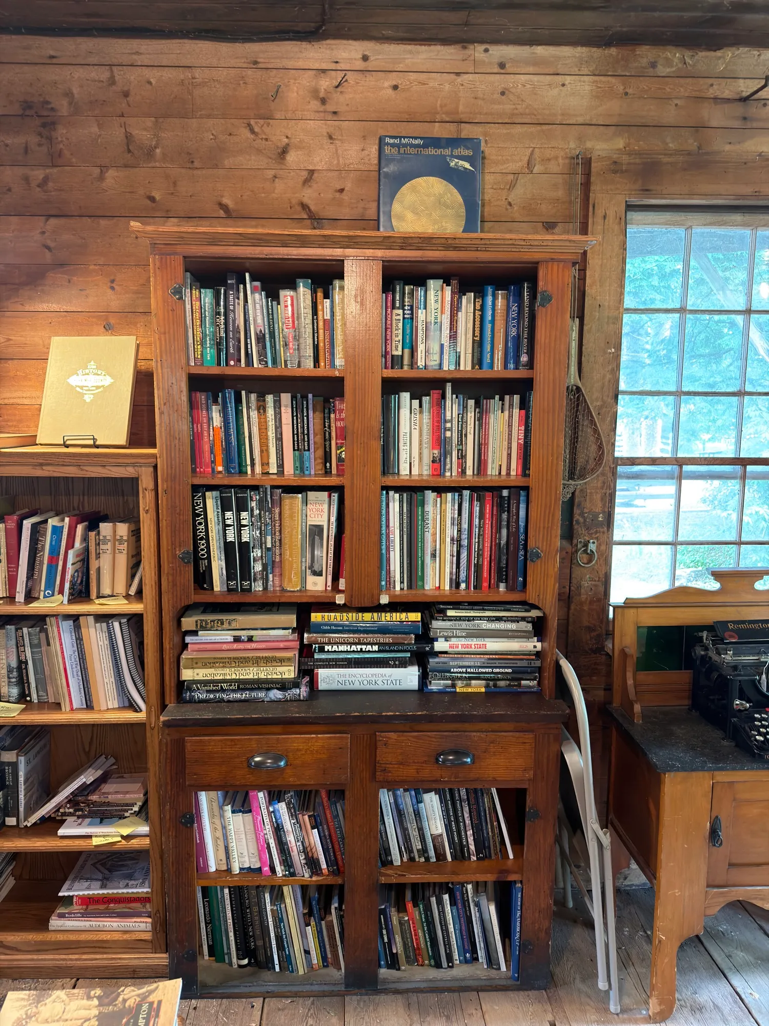 A tall bookcase full of finds